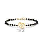 Load image into Gallery viewer, gold-baby-feet-nazariya-bracelet-with-black-beads-mgsbrc11612angle1-nl-yg-hw