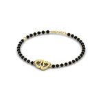 Load image into Gallery viewer, gold-baby-feet-nazariya-bracelet-with-black-beads-mgsbrc11612angle2-nl-yg