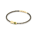 Load image into Gallery viewer, infinity-knot-emerald-mens-mangalsutra-hand-bracelet-in-yellow-gold-mgsmbrc11839gemgrangle2-nl-yg.jpg