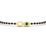 Load image into Gallery viewer, infinity-knot-emerald-mens-mangalsutra-hand-bracelet-in-yellow-gold-mgsmbrc11839gemgrangle5-nl-yg.jpg