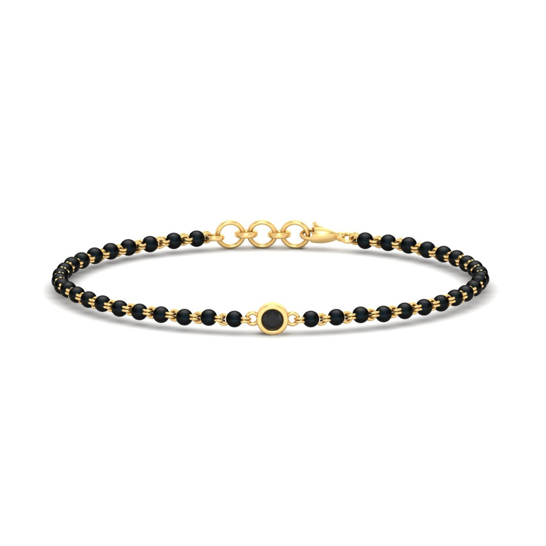 mens-single-bezel-set-black-diamond-mangalsutra-bracelet-in-yellow-gold-mgsmbrc11836blackangle1-nl-yg.jpg
