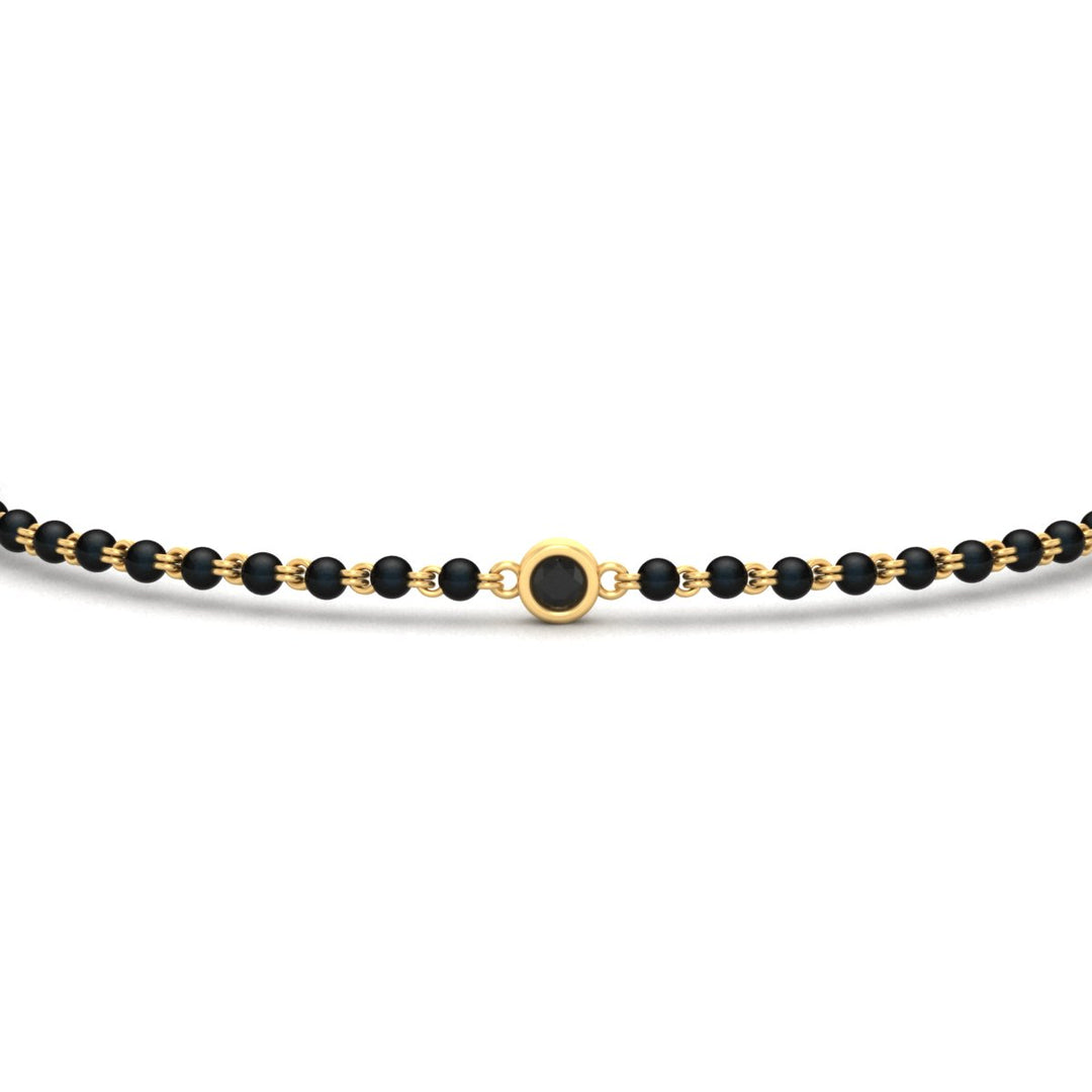 mens-single-bezel-set-black-diamond-mangalsutra-bracelet-in-yellow-gold-mgsmbrc11836blackangle5-nl-yg.jpg