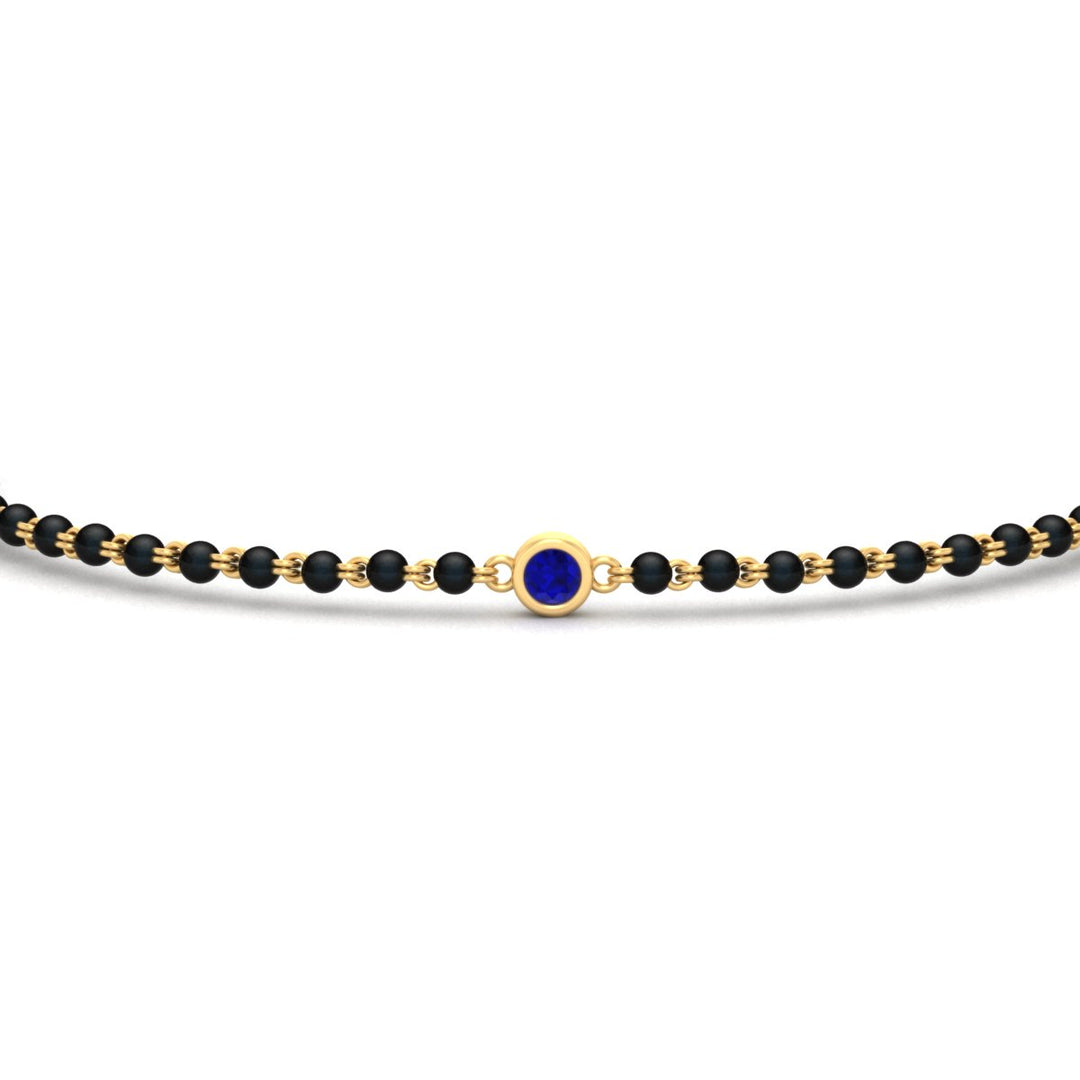 mens-single-bezel-set-sapphire-mangalsutra-bracelet-in-yellow-gold-mgsmbrc11836gsablangle5-nl-yg.jpg