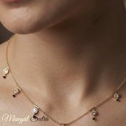 round-diamond-bezel-station-black-bead-mangalsutra-MGS11773-YG-logo